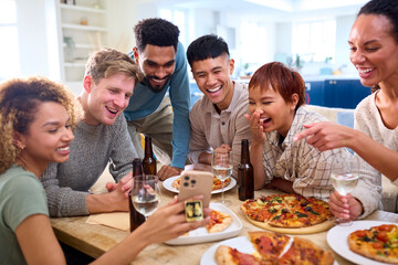 Friends Taking Selfie On Phone Having Fun At Home In Kitchen Eating Homemade Pizzas