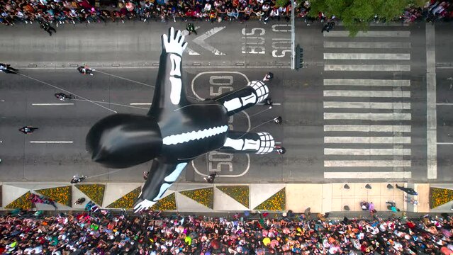 aerial view of a traditional dance with mannequins in oaxaca city at sunset