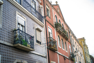 historic buildings of the old town of lisbon. Old colorful buildings, narrow streets, historic churches. Cloudy day