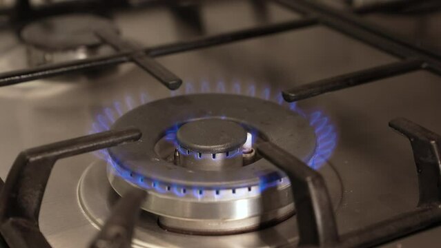 Burning of gas on a gas stove. Gas cooker hob flame. Natural Gas Prices Continue To Climb. Lighting a gas flame on a gas cooker. Gas cooker hob flame.