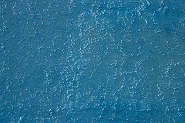 Light blue colored abstract wall background with textures of different shades of blue