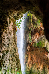 Beautiful waterfall inside the stone monastery inside a grotto. Zaragoza. Spain