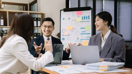 Group of Young Asian business team creative businesspeople coworker in office.