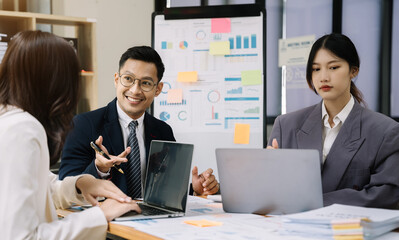 Group of Young Asian business team creative businesspeople coworker in office.