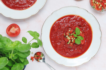 Plates with traditional gazpacho tomato soup	