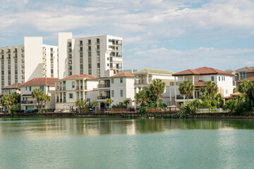 Views of three-storey villas and apartments with lakefront view in Destin, Florida