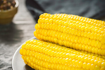 Delicious corn on the cob with melted butter. Close up with copy space. 