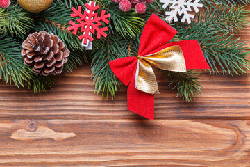 Fototapeta na wymiar beautiful branches of the Christmas tree with cones and toys