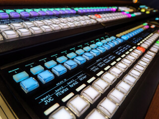 AMSTERDAM - SEP 11, 2022: Professional broadcast video mixer in tv studio as background