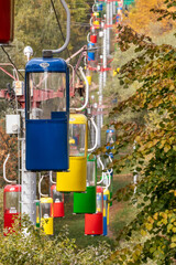 Colorful cableway transport cabins in Kharkiv city amusement park in autumn