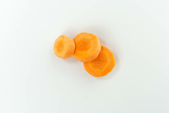 raw carrot slices isolated on white background