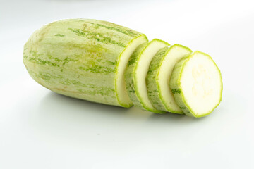 sliced fresh green cucumber isolated on a white background