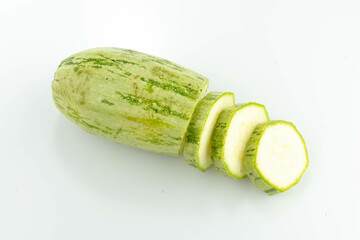 sliced fresh green cucumber isolated on a white background
