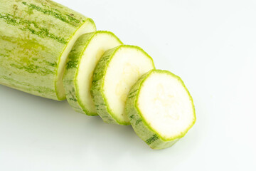 sliced fresh green cucumber isolated on a white background