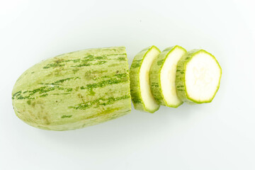 sliced fresh green cucumber isolated on a white background top view