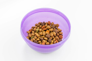 bowl with dry dog food isolated on a white background