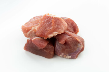 fresh raw meat cubes isolated on a white bacground