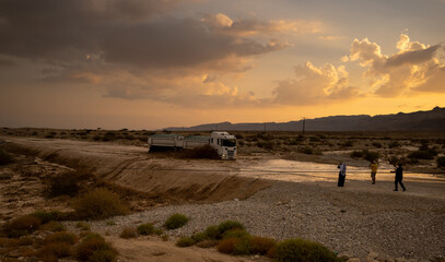A truck is crossing the flooded highway 90, by the dead sea in Israel.