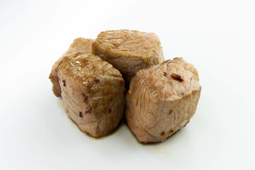 fresh baked meat cubes isolated on a white bacground