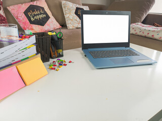 mockup image, laptop computer with blank screen in modern home room. with white space layout on a white table