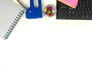 Flat lay, white desk in the office with layout space.with office equipment such as pencils, notebooks and keyboards at the top.mock up table