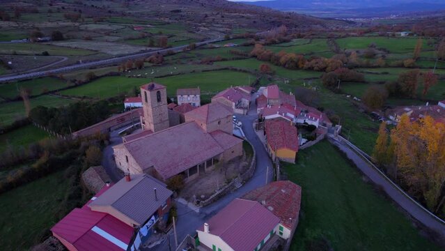 Aerial view of Santiago del collado village at sunset in &Aacute;vila, Spain. 4K cinematic shot