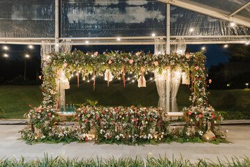 Wedding reception stage for husband and wife at the center, beautiful decoration and flower...