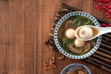 Eating big tangyuan yuanxiao with savory soup in Taiwan.