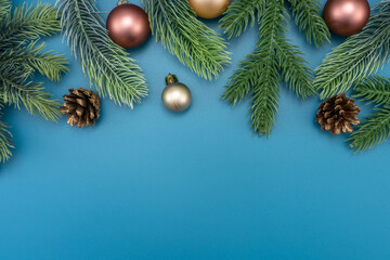 Christmas composition. festive decor on blue background. Copy space, flat lay, top view.
