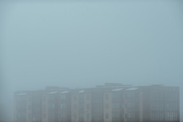part of autumn
natural landscape with a view of space;
high-rise building in the fog