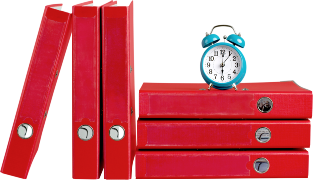 File organizers,binders with an alarm clock on top of them