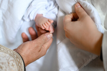 The sacrament of baptism of an infant in the church.