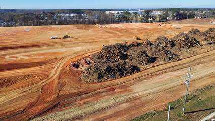 Top view huge debris pile loads from house demolition and tree trunk removal at large warehouse...