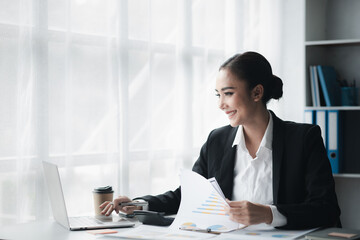 Beautiful Asian woman is a businesswoman who leads a new generation of startups, a woman who runs and manages a business plan to build confidence and stability in business, woman-led business concept.