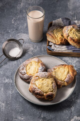 Patties with cottage cheese on a marble table. Russian pastry (vatrushka)