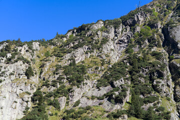 Scenic view of famous Schöllenen Gorge, Canton Uri, on a sunny late summer afternoon. Photo taken September 12th, 2022, Schöllenen Gorge, Switzerland.
