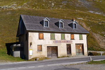 Abandoned troop barracks of Swiss Army at mountain pass Furkapass on a sunny late summer day. Photo taken September 12th, 2022, Furka Pass, Switzerland.