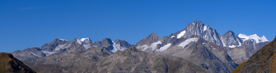 Beautiful wide angle mountain panorama with peak Finsteraarhorn 4274 m seen from Swiss mountain...