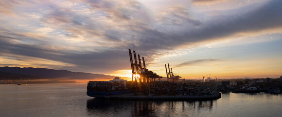 Panoramic skyline view of Vancouver international industrial port with freight and shipment docks.