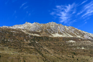 Scenic landscape at Swiss mountain valley Urserntal, Canton Uri, in the Swiss Alps on a sunny late summer day. Photo taken September 12th, 2022, Ursern Valley, Switzerland.