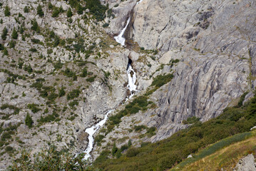 Aerial view of mountain panorama in the Swiss Alps at region of Swiss mountain pass Furkapass with Rhone River on a sunny late summer day. Photo taken September 12th, 2022, Furka Pass, Switzerland.