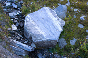 Scenic view of famous Swiss mountain pass Furkapass with rocks and mountain peak on a sunny late summer day. Photo taken September 12th, 2022, Furka Pass, Switzerland.