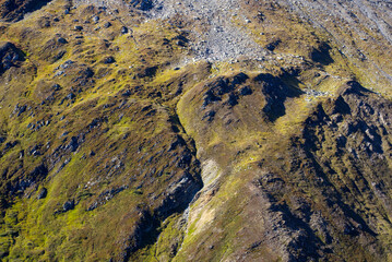 Scenic view of famous Swiss mountain pass Furkapass with rocks and mountain peak on a sunny late...
