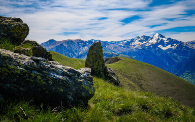 View from the Tuc de l'Etang on the Tuc de Cradere and the snow-covered peaks of the Pyrenees mountain range in the south of France (Haute Garonne)