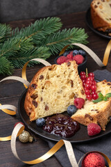 Traditional Italian Christmas fruitcake panettone with raisins and candied fruits. Holiday food for Christmas and New Year	