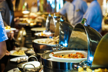 People grab buffet food and salad food in hotel restaurant seminar trainning