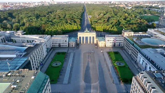 Aerial View of Brandenburg Gate (Brandenburger Tor) early morning at sunrise - monument in Berlin, Capital of Germany, Europe, with Skyline at the Background. 4K Shot of European City Landmark