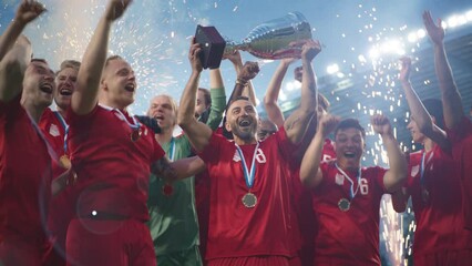 Football Finals Tournament Winning Team Celebrates Victory Cheering and Lifting Trophy Prize, Showing it to the Whole Stadium Arena. Happy Soccer Players Champions of International Championship Cup