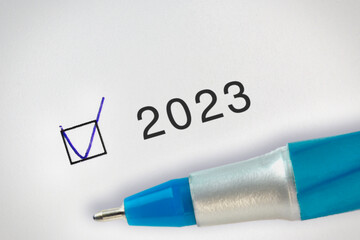 2023 Done concept. Check mark with hand drawn V mark in a box near the text 2023 year.