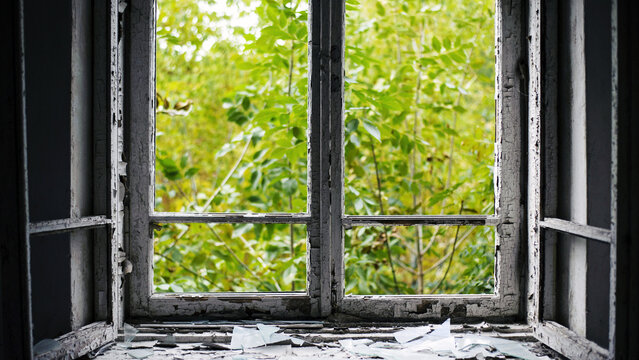 Open Window With Old Wooden Frame. Old Window. Finely Broken Glass. Old House, Retro. Cracked Window Frame. Cracked Old Paint, Pieces Of Glass. Space For Text. Large Pieces Of Glass. Close-up